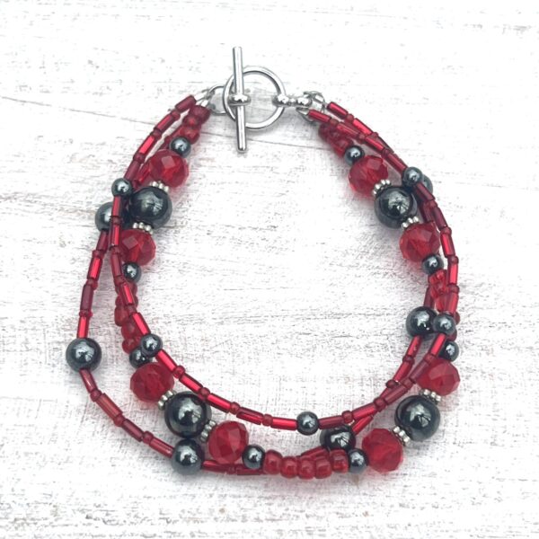 Red Glass and Gunmetal Triple Strand Bracelet & Earrings Set