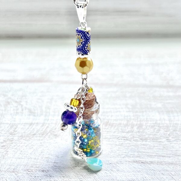 Purple and Yellow Flower Clay Potion Bottle Necklace